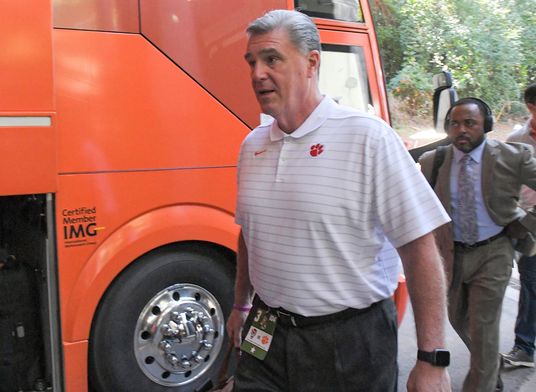 Clemson University Athletic Director Dan Radakovich gets off the bus before the game with NC State University at Carter-Finley Stadium in Raleigh, N.C., September 25, 2021.

Ncaa Football Clemson At Nc State