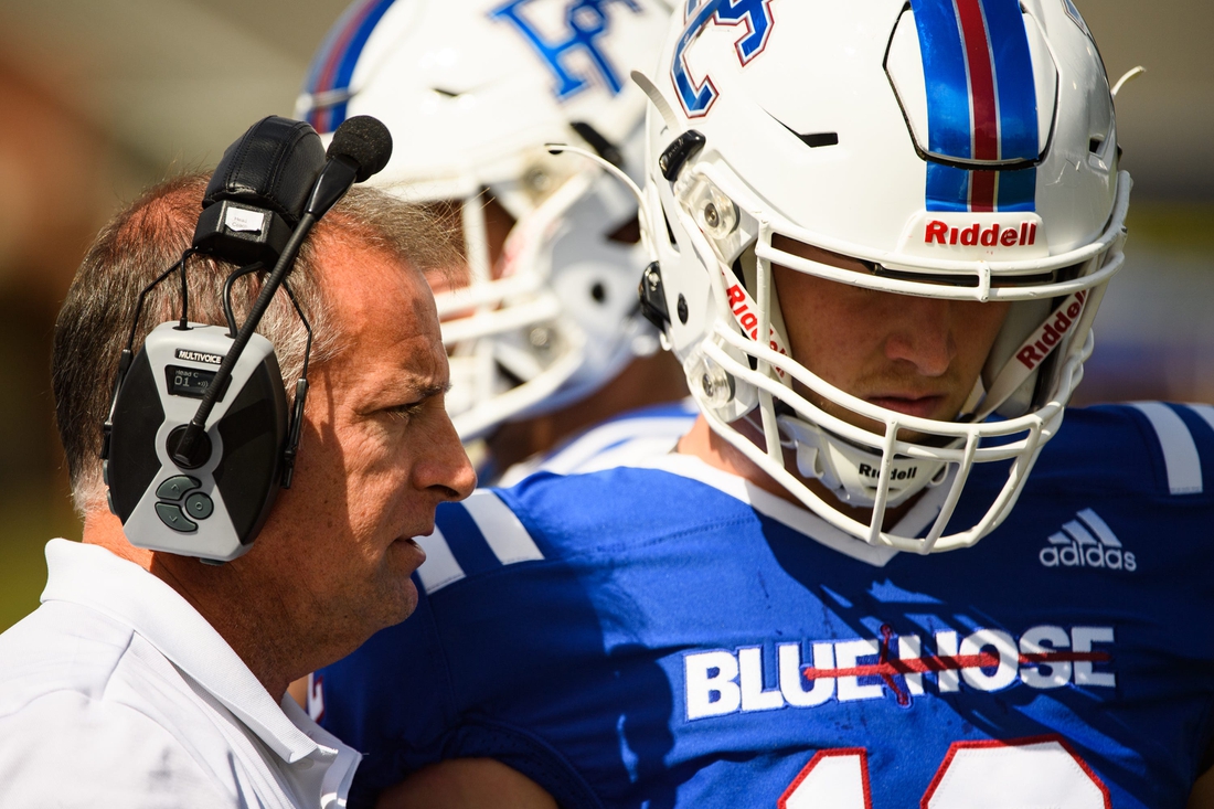 Presbyterian College head coach Kevin Kelley speaks with quarterback Ren Hefley (12) during their game against Morehead State at Bailey Memorial Stadium Saturday, Oct. 9, 2021.

Jm Prescollege 101221 007