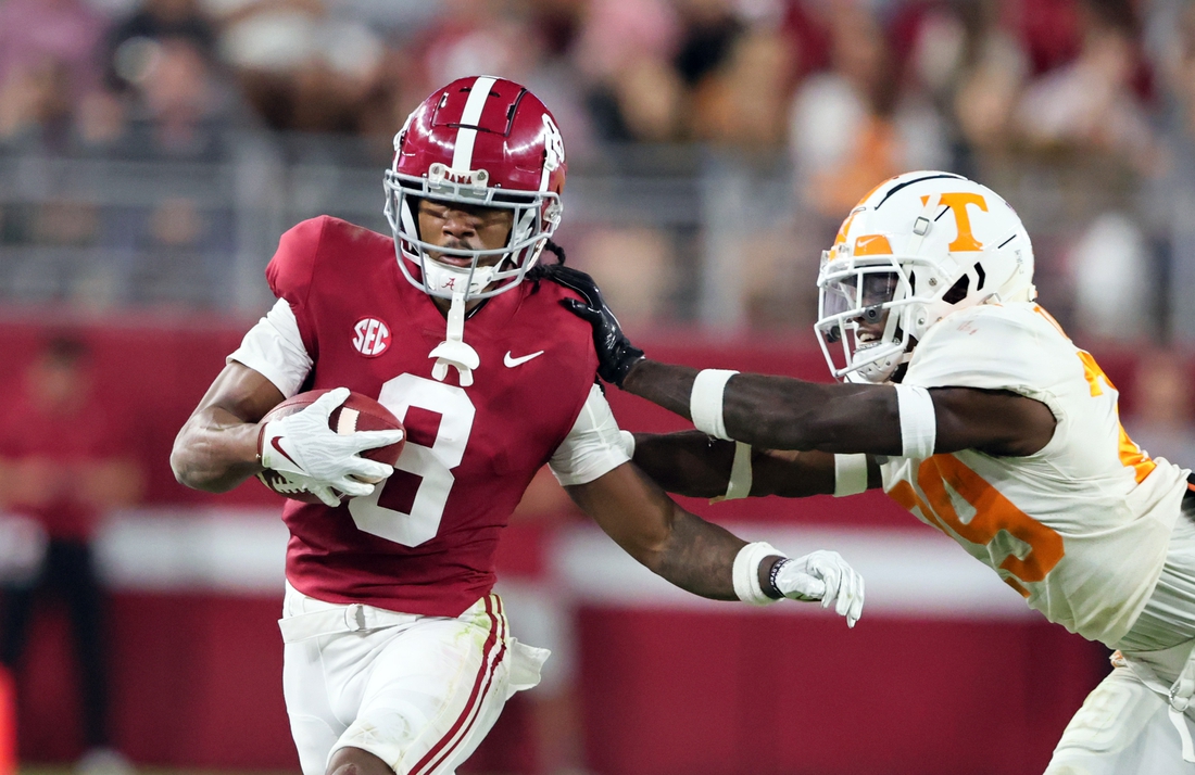 Oct 23, 2021; Tuscaloosa, Alabama, USA; Alabama Crimson Tide wide receiver John Metchie III (8) is pushed out of bounds by Tennessee Volunteers defensive back Brandon Turnage (29) during the first half at Bryant-Denny Stadium. Mandatory Credit: Butch Dill-USA TODAY Sports