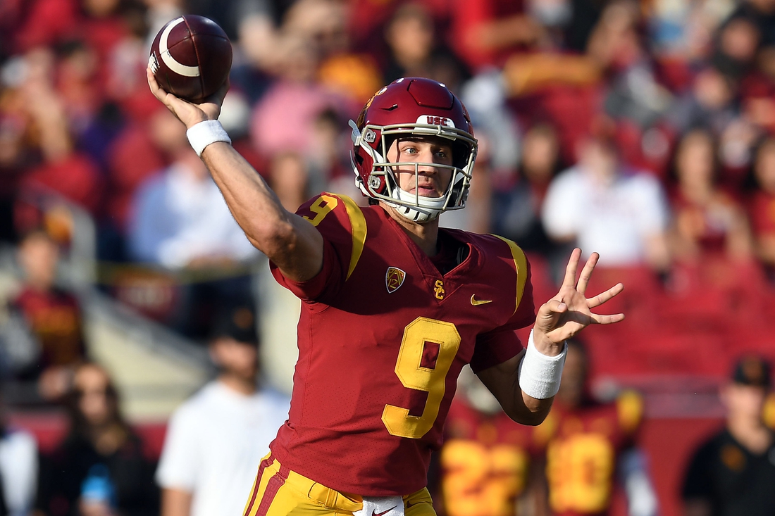 Oct 30, 2021; Los Angeles, California, USA; Southern California Trojans quarterback Kedon Slovis (9) throws against the Arizona Wildcats during the first half at United Airlines Field at Los Angeles Memorial Coliseum. Mandatory Credit: Gary A. Vasquez-USA TODAY Sports