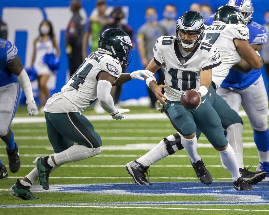 Oct 31, 2021; Detroit, Michigan, USA; Philadelphia Eagles quarterback Gardner Minshew (10) hands off the football to running back Kenneth Gainwell (14) in the second half of an NFL game against the Detroit Lions at Ford Field. Mandatory Credit: David Reginek-USA TODAY Sports