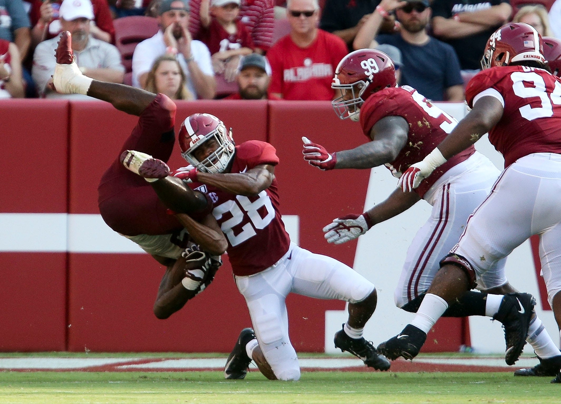 Alabama defensive back Josh Jobe (28) upends a New Mexico State running back during the second half of Alabama's 62-10 victory over New Mexico State in Bryant-Denny Stadium Saturday, Sep. 7, 2019. [Staff Photo/Gary Cosby Jr.]

Alabama Vs New Mexico State