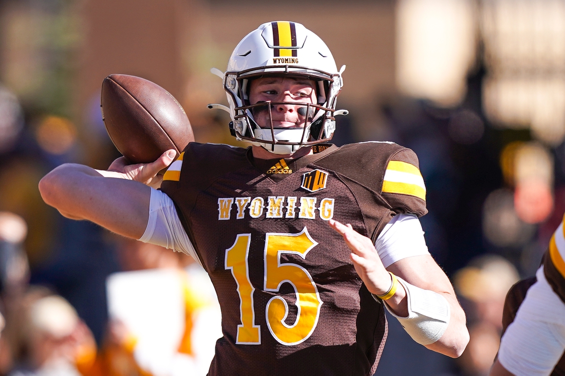 Nov 06, 2021; Laramie, WY, USA; Wyoming Cowboys quarterback Levi Williams (15) warms up before the game against the Colorado State Rams at War Memorial Stadium. Mandatory Credit: Troy Babbitt-USA TODAY Sports
