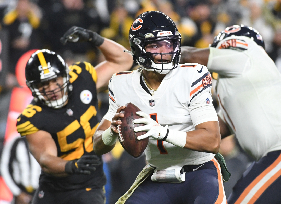 Nov 8, 2021; Pittsburgh, Pennsylvania, USA;  Chicago Bears quarterback Justin Fields (1) throws a fourth quarter pass under pressure from Pittsburgh Steelers linebacker Alex Highsmith (56)  at Heinz Field. The Steelers won 29-27. Mandatory Credit: Philip G. Pavely-USA TODAY Sports