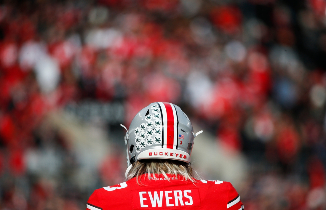 Sat., Nov. 20, 2021; Columbus, Ohio, USA; Ohio State Buckeyes quarterback Quinn Ewers (3) practices on the sideline during a break in play in the second quarter of a NCAA Division I football game between the Ohio State Buckeyes and the Michigan State Spartans at Ohio Stadium. Mandatory Credit: Joshua A. Bickel/Columbus Dispatch via USA TODAY Network.Cfb Michigan State Spartans At Ohio State Buckeyes