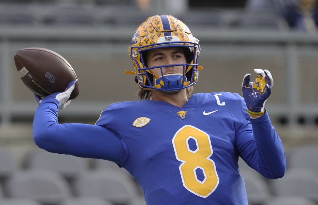 Nov 20, 2021; Pittsburgh, Pennsylvania, USA;  Pittsburgh Panthers quarterback Kenny Pickett (8) warms up before the game against the Virginia Cavaliers at Heinz Field. Mandatory Credit: Charles LeClaire-USA TODAY Sports