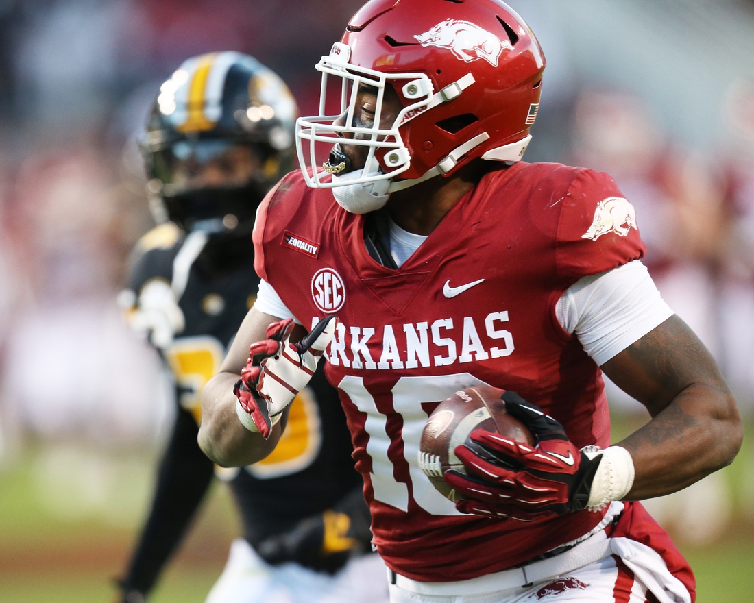 Nov 26, 2021; Fayetteville, Arkansas, USA; Arkansas Razorbacks wide receiver Treylon Burks (16) catches a pass and runs it in for a touchdown in the third quarter against the Missouri Tigers at Donald W. Reynolds Razorbacks Stadium. Mandatory Credit: Nelson Chenault-USA TODAY Sports