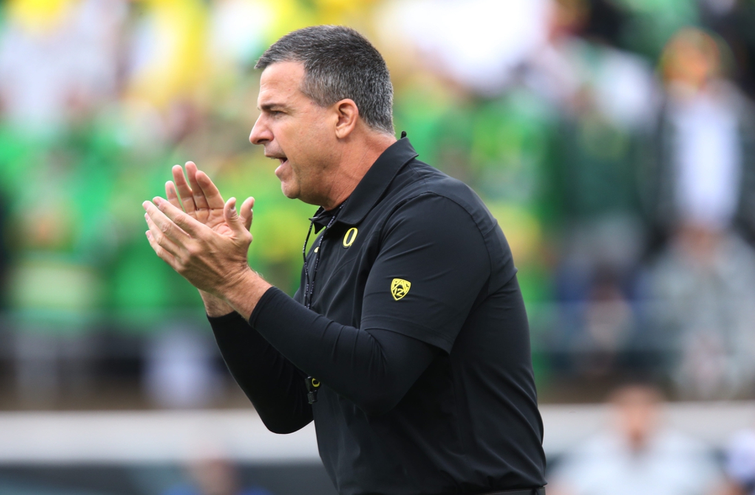 Oregon head coach Mario Cristobal oversees warmups before the game against Oregon State.

Eug 111427 Uofb 02