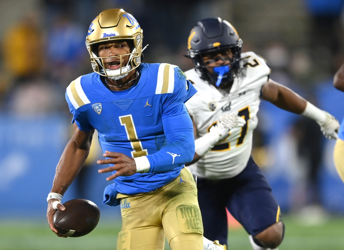 Nov 27, 2021; Pasadena, California, USA;    UCLA Bruins quarterback Dorian Thompson-Robinson (1) runs for 17 yards and a first down against the California Golden Bears in the second half at the Rose Bowl. Mandatory Credit: Jayne Kamin-Oncea-USA TODAY Sports