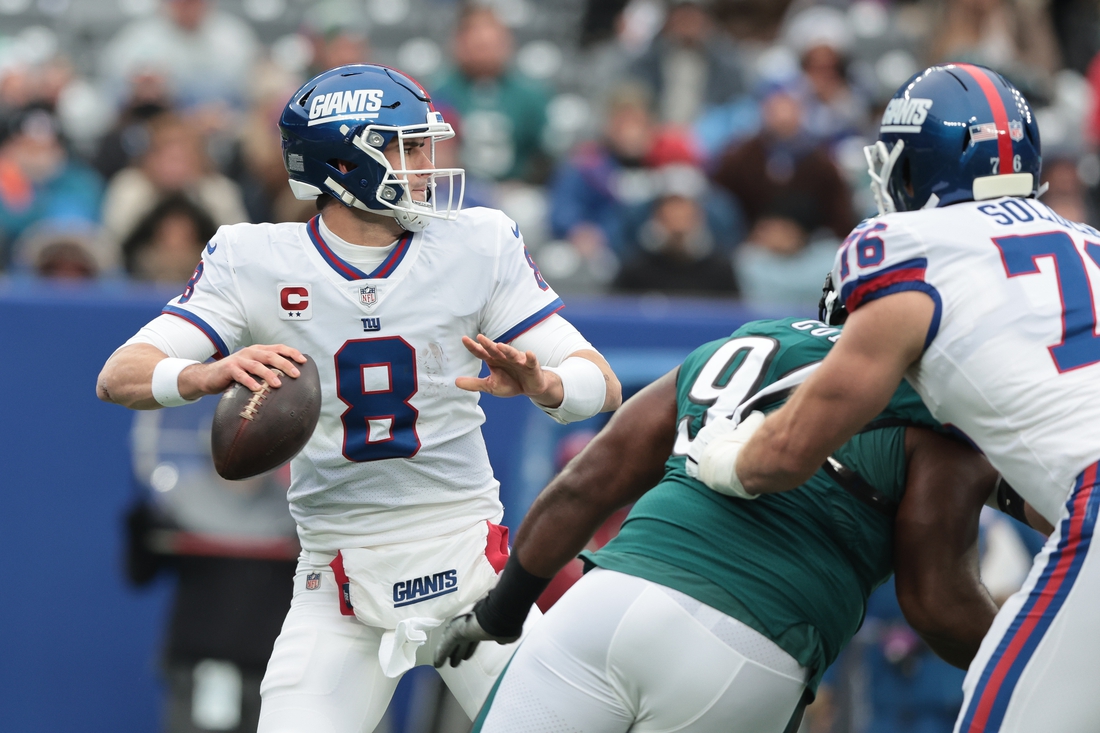 Nov 28, 2021; East Rutherford, New Jersey, USA; New York Giants quarterback Daniel Jones (8) throws the ball against the Philadelphia Eagles during the first quarter at MetLife Stadium. Mandatory Credit: Vincent Carchietta-USA TODAY Sports