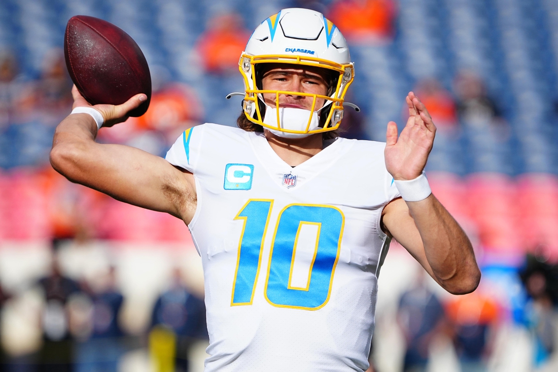 Nov 28, 2021; Denver, Colorado, USA; Los Angeles Chargers quarterback Justin Herbert (10) before the game against the Denver Broncos at Empower Field at Mile High. Mandatory Credit: Ron Chenoy-USA TODAY Sports