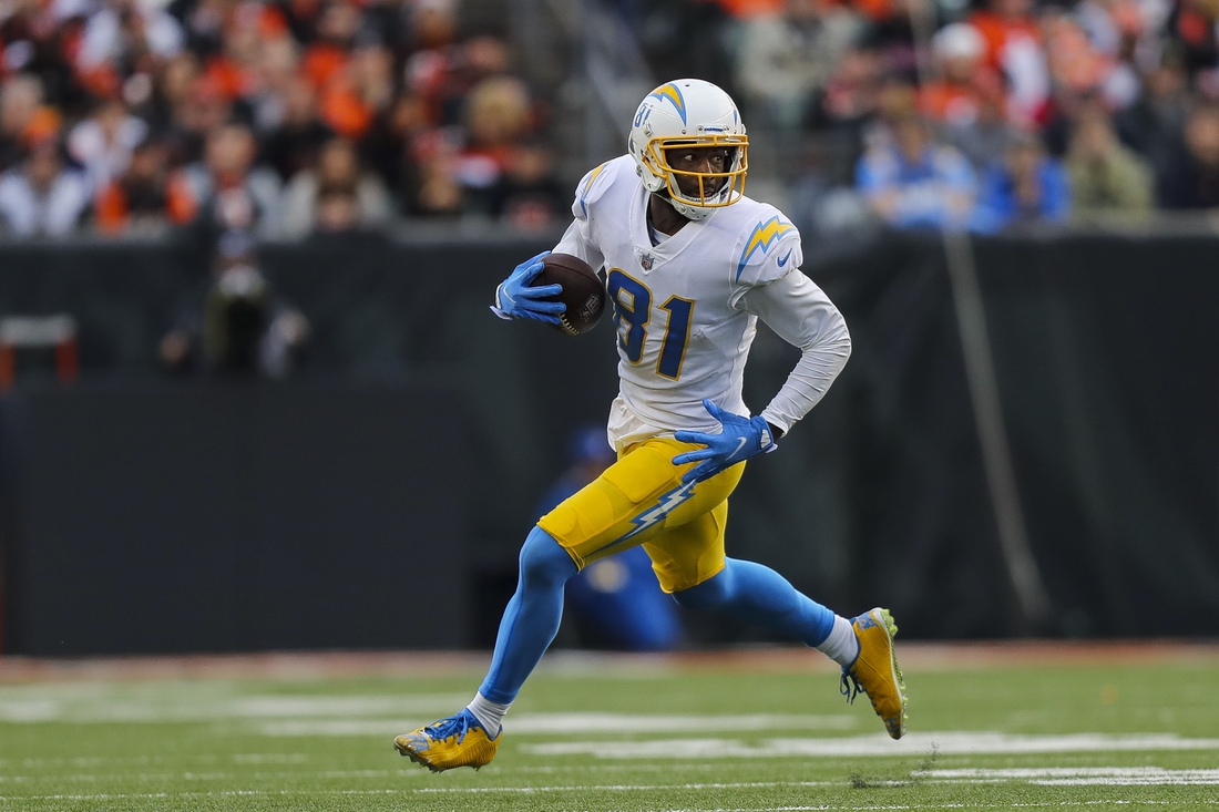 Dec 5, 2021; Cincinnati, Ohio, USA; Los Angeles Chargers wide receiver Mike Williams (81) runs with the ball against the Cincinnati Bengals in the second half at Paul Brown Stadium. Mandatory Credit: Katie Stratman-USA TODAY Sports