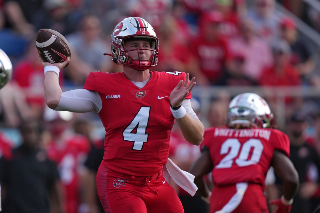 Dec 18, 2021; Boca Raton, Florida, USA; Western Kentucky Hilltoppers quarterback Bailey Zappe (4) attempts a pass against the Appalachian State Mountaineers during the first half in the 2021 Boca Raton Bowl at FAU Stadium. Mandatory Credit: Jasen Vinlove-USA TODAY Sports