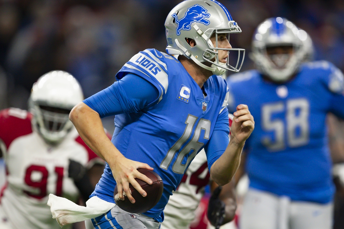 Dec 19, 2021; Detroit, Michigan, USA; Detroit Lions quarterback Jared Goff (16) runs with the ball during the fourth quarter against the Arizona Cardinals at Ford Field. Mandatory Credit: Raj Mehta-USA TODAY Sports