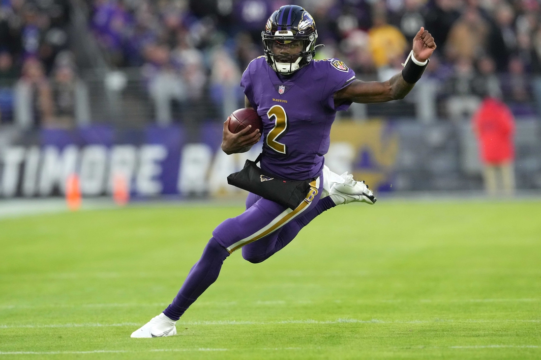 Dec 19, 2021; Baltimore, Maryland, USA; Baltimore Ravens quarterback Tyler Huntley (2) runs the ball in the first quarter against the Green Bay Packers at M&T Bank Stadium. Mandatory Credit: Mitch Stringer-USA TODAY Sports