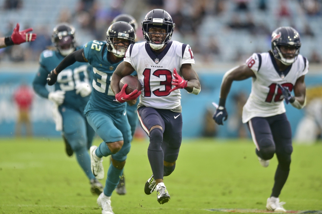 Houston Texans wide receiver Brandin Cooks (13) scores the final touchdown for Houston as Jacksonville Jaguars cornerback Tyson Campbell (32) can't make the tackle during the fourth quarter Sunday, Dec. 2021 at TIAA Bank Field in Jacksonville. The Jaguars hosted the Texans during a regular season NFL game. Houston defeated Jacksonville 30-16. [Corey Perrine/Florida Times-Union]

Jki 121921 Jagstexans 26