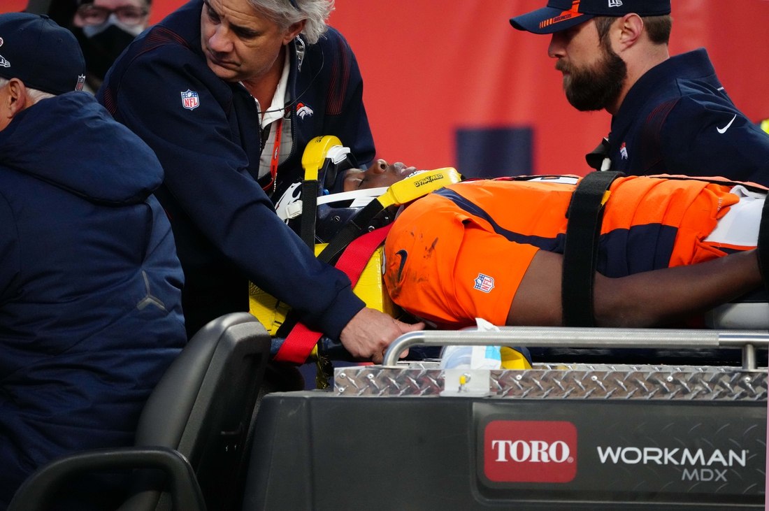 Dec 19, 2021; Denver, Colorado, USA; Denver Broncos quarterback Teddy Bridgewater (5) is carted off the field in the third quarter against the Cincinnati Bengals at Empower Field at Mile High Mandatory Credit: Ron Chenoy-USA TODAY Sports
