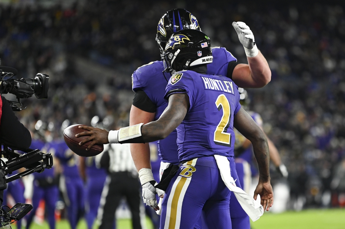 Dec 19, 2021; Baltimore, Maryland, USA;  Baltimore Ravens quarterback Tyler Huntley (2) celebrates with  tight end Mark Andrews (89) after scoring a touchdown  during during the second half against the Green Bay Packersat M&T Bank Stadium. Mandatory Credit: Tommy Gilligan-USA TODAY Sports