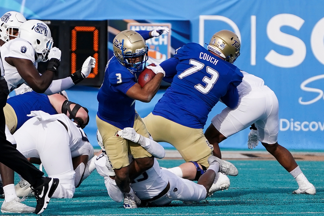 Dec 20, 2021; Conway, South Carolina, USA; Tulsa Golden Hurricane running back Shamari Brooks (3) is tackled by Old Dominion Monarchs safety Terry Jones during (13) in the 2021 Myrtle Beach Bowl at Brooks Stadium. Mandatory Credit: David Yeazell-USA TODAY Sports