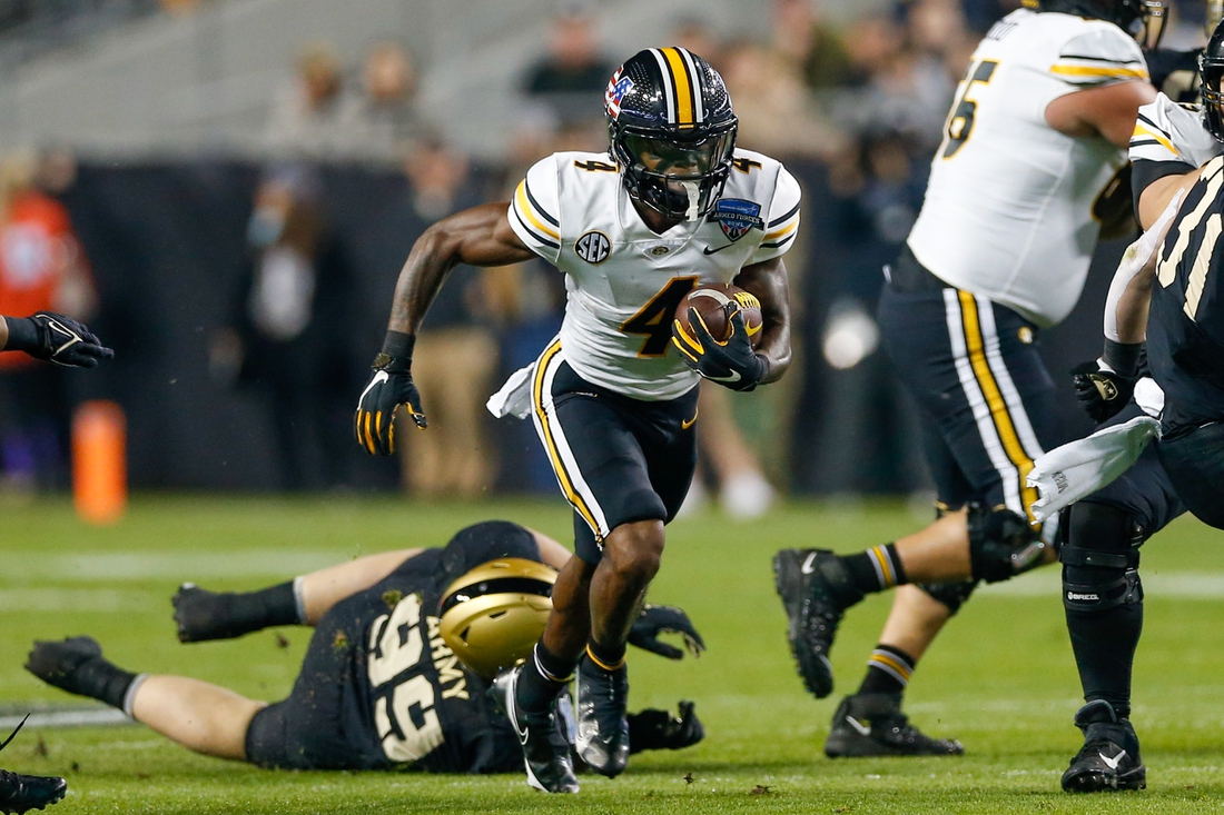 Dec 22, 2021; Fort Worth, Texas, USA; Missouri Tigers running back Elijah Young (4) breaks through a hole in the line against the Missouri Tigers during the first quarter of the 2021 Armed Forces Bowl at Amon G. Carter Stadium. Mandatory Credit: Andrew Dieb-USA TODAY Sports