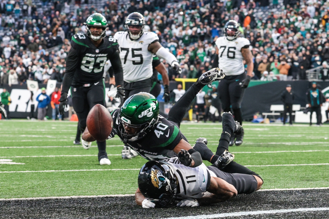 Dec 26, 2021; East Rutherford, New Jersey, USA; New York Jets cornerback Javelin Guidry (40) breaks up a pass intended for Jacksonville Jaguars wide receiver Marvin Jones (11) during the second half at MetLife Stadium. Mandatory Credit: Vincent Carchietta-USA TODAY Sports