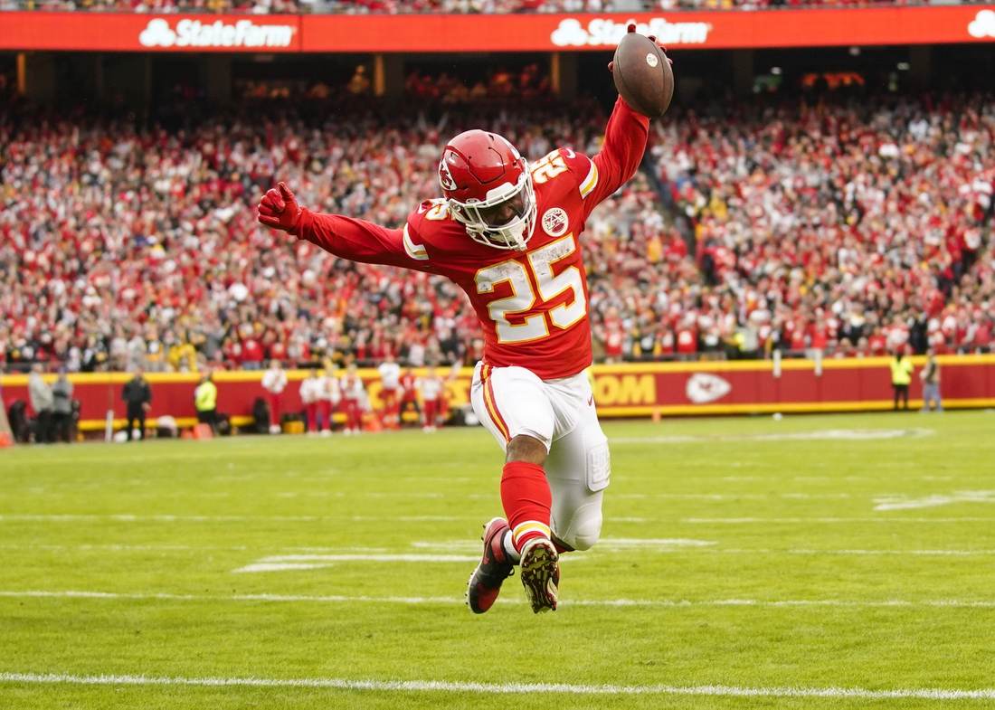 Dec 26, 2021; Kansas City, Missouri, USA; Kansas City Chiefs running back Clyde Edwards-Helaire (25) runs for a touchdown against the Pittsburgh Steelers during the first half at GEHA Field at Arrowhead Stadium. Mandatory Credit: Jay Biggerstaff-USA TODAY Sports