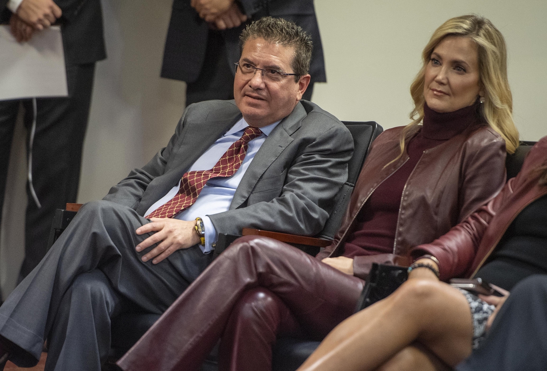 Jan 2, 2020; Ashburn, VA, USA; Washington Redskins owner Daniel Snyder and his wife Tanya look on as head coach Ron Rivera speaks during his introductory press conference at Inova Sports Performance Center. Mandatory Credit: Brad Mills-USA TODAY Sports