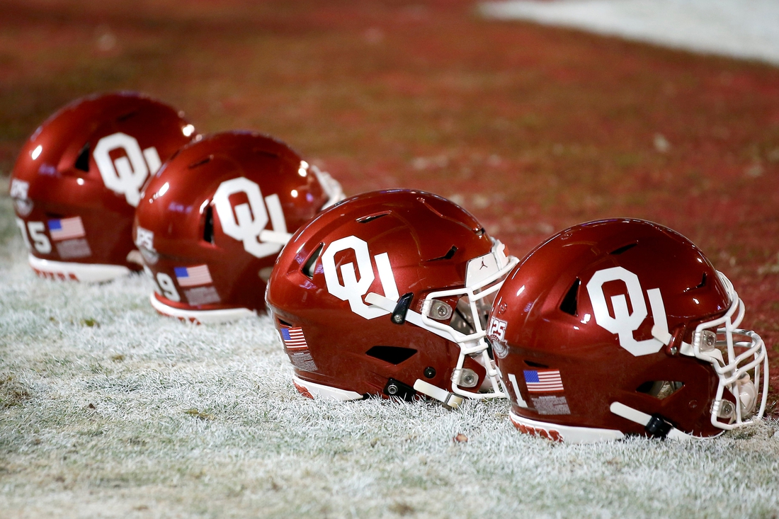Helmets sit on the field before an NCAA football game between the University of Oklahoma Sooners (OU) and the TCU Horned Frogs at Gaylord Family-Oklahoma Memorial Stadium in Norman, Okla., Saturday, Nov. 23, 2019. Oklahoma won 28-24. [Bryan Terry/The Oklahoman]
