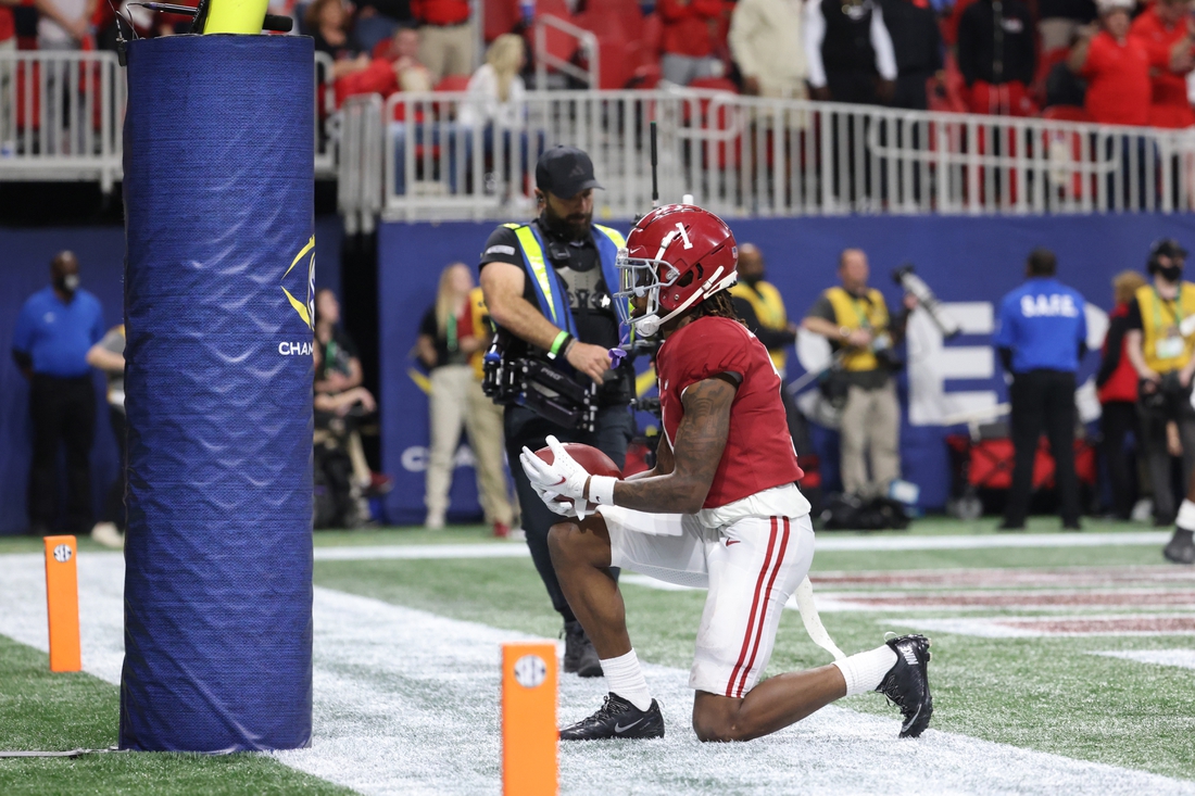 Dec 4, 2021; Atlanta, GA, USA; Alabama Crimson Tide wide receiver Jameson Williams (1) celebrates at the goal post after a receiving touchdown during the third quarter against the Georgia Bulldogs during the SEC championship game at Mercedes-Benz Stadium. Mandatory Credit: Jason Getz-USA TODAY Sports