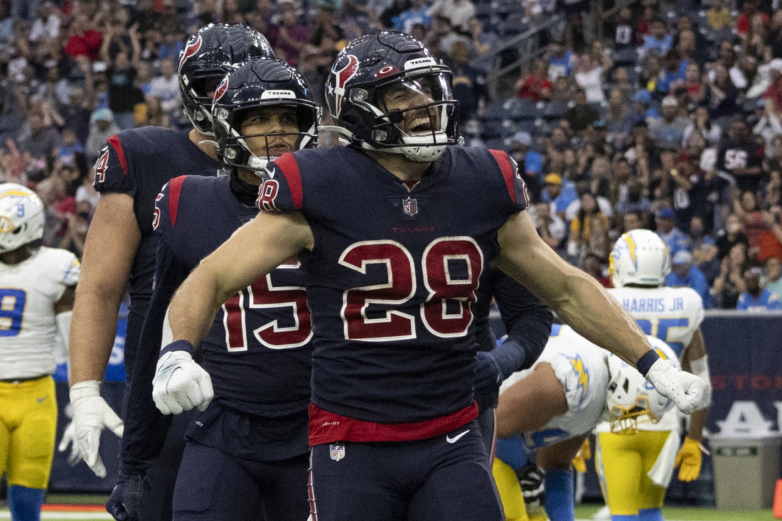 Dec 26, 2021; Houston, Texas, USA; Houston Texans running back Rex Burkhead (28) celebrates after scoring a touchdown against the Los Angeles Chargers in the fourth quarter at NRG Stadium. Mandatory Credit: Thomas Shea-USA TODAY Sports