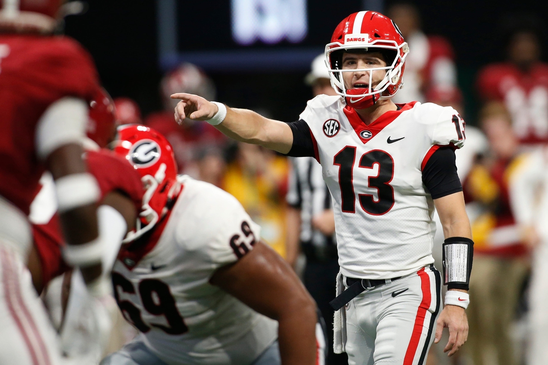 Georgia quarterback Stetson Bennett (13) gets set to run a play during the first half of the Southeastern Conference championship NCAA college football game between Georgia and Alabama in Atlanta, on Saturday, Dec. 4, 2021.

News Joshua L Jones

Syndication Online Athens

Syndication Palm Beach Post