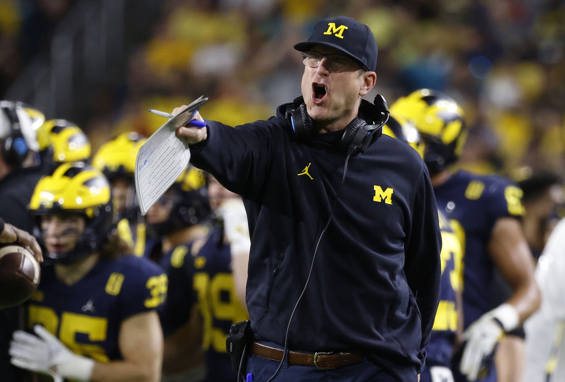 Dec 31, 2021; Miami Gardens, Florida, USA; Michigan Wolverines head coach Jim Harbaugh reacts from the sideline during the second half in the Orange Bowl college football CFP national semifinal game against the Georgia Bulldogs at Hard Rock Stadium. Mandatory Credit:  Rhona Wise-USA TODAY Sports