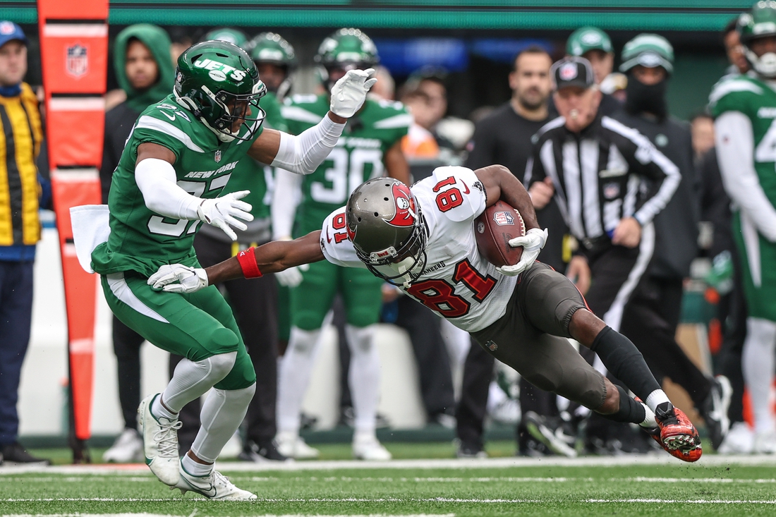 Jan 2, 2022; East Rutherford, New Jersey, USA; Tampa Bay Buccaneers wide receiver Antonio Brown (81) is tackled by New York Jets cornerback Bryce Hall (37) after a catch during the first half at MetLife Stadium. Mandatory Credit: Vincent Carchietta-USA TODAY Sports