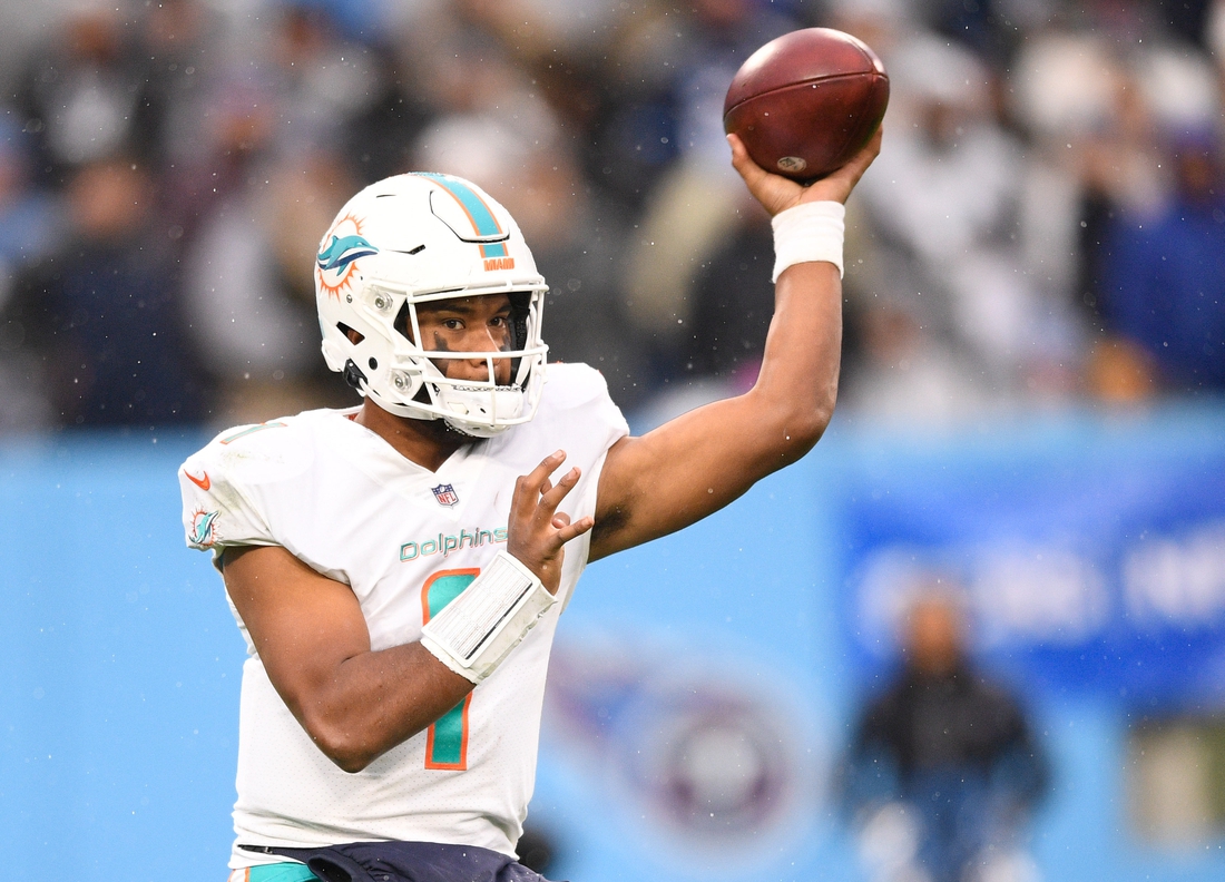 Jan 2, 2022; Nashville, Tennessee, USA;  Miami Dolphins quarterback Tua Tagovailoa (1) throws a pass against the Tennessee Titans during the second half at Nissan Stadium. Mandatory Credit: Steve Roberts-USA TODAY Sports