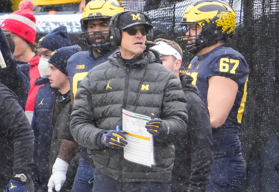 Michigan Wolverines head coach Jim Harbaugh stands on the sideline during the NCAA football game at Michigan Stadium in Ann Arbor on Monday, Nov. 29, 2021.

Ohio State Buckeyes At Michigan Wolverines