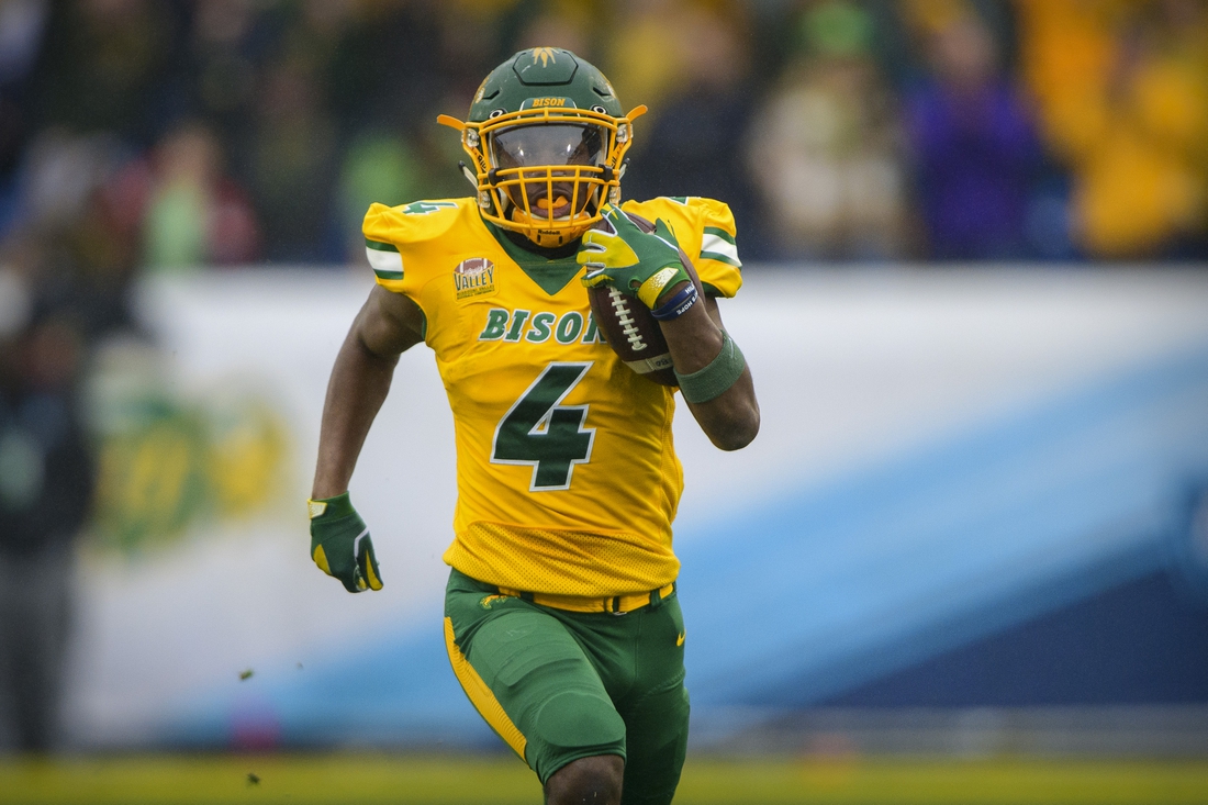 Jan 8, 2022; Frisco, TX, USA; North Dakota State Bison running back Kobe Johnson (4) rushes for a touchdown against the Montana State Bobcats during the first half of the FCS Championship at Toyota Stadium. Mandatory Credit: Jerome Miron-USA TODAY Sports