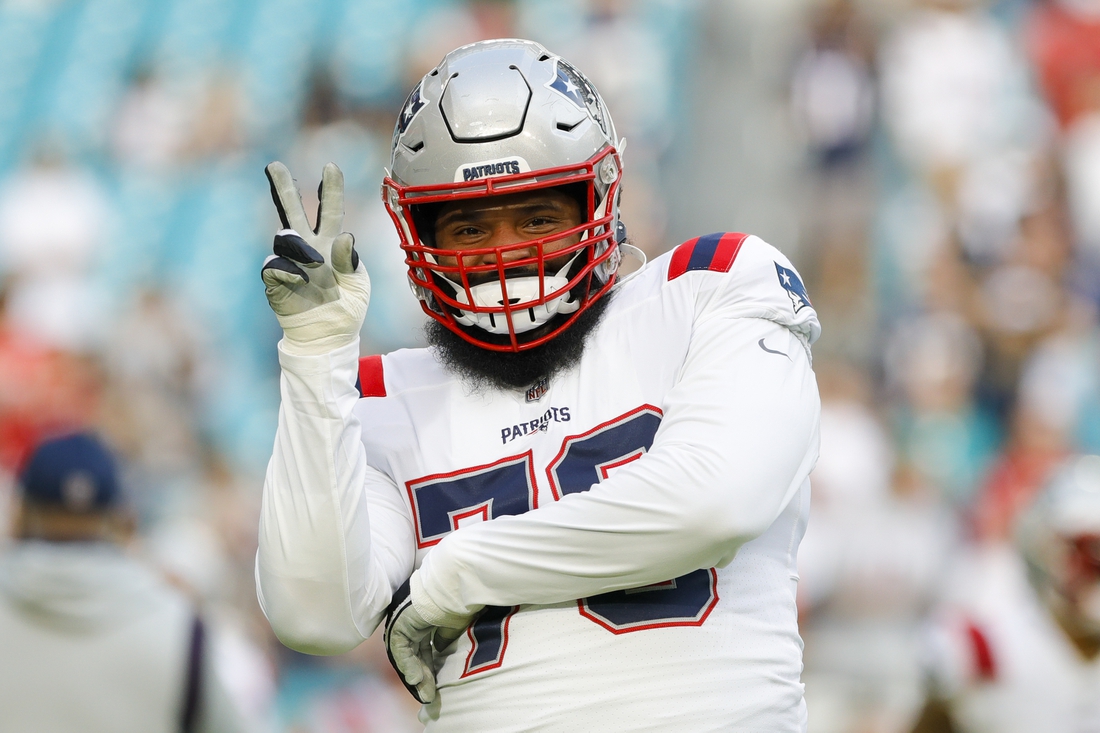Jan 9, 2022; Miami Gardens, Florida, USA; New England Patriots offensive tackle Isaiah Wynn (76) reacts from the field prior to the game against the Miami Dolphins at Hard Rock Stadium. Mandatory Credit: Sam Navarro-USA TODAY Sports