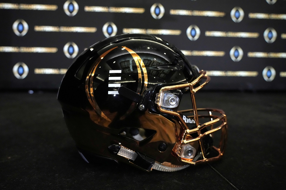 Jan 11, 2022; Indianapolis, Indiana, USA; A detailed view of College Football Playoff National Championship logo helmet at  2022 Indianapolis Host Committee press conference at the JW Marriott. Mandatory Credit: Kirby Lee-USA TODAY Sports