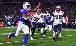 Jan 15, 2022; Orchard Park, New York, USA; Buffalo Bills running back Devin Singletary (26) runs for a touchdown during the second quarter of the AFC Wild Card playoff game against the New England Patriots at Highmark Stadium. Mandatory Credit: Mark Konezny-USA TODAY Sports