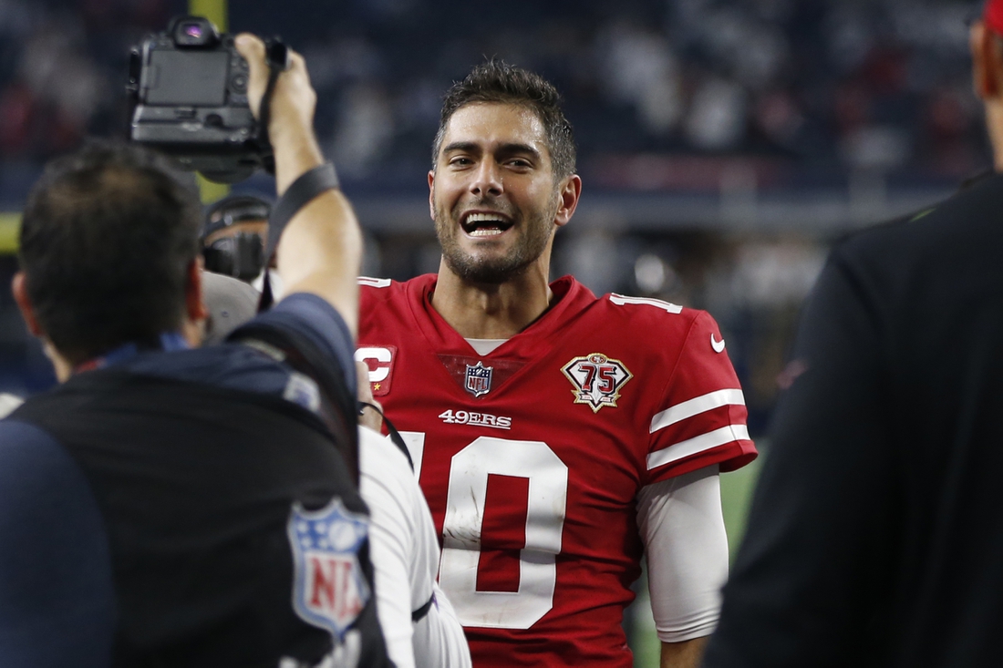 Jan 16, 2022; Arlington, Texas, USA; San Francisco 49ers quarterback Jimmy Garoppolo (10) leaves the field after the game against the Dallas Cowboys in a NFC Wild Card playoff football game at AT&T Stadium. Mandatory Credit: Tim Heitman-USA TODAY Sports