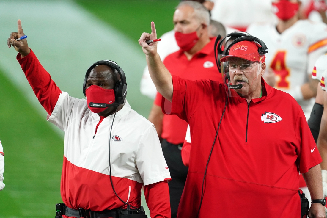 Nov 22, 2020; Paradise, Nevada, USA; Kansas City Chiefs offensive coordinator Eric Bieniemy (left) and coach Andy Reid react during the game against the Las Vegas Raiders at Allegiant Stadium. Mandatory Credit: Kirby Lee-USA TODAY Sports