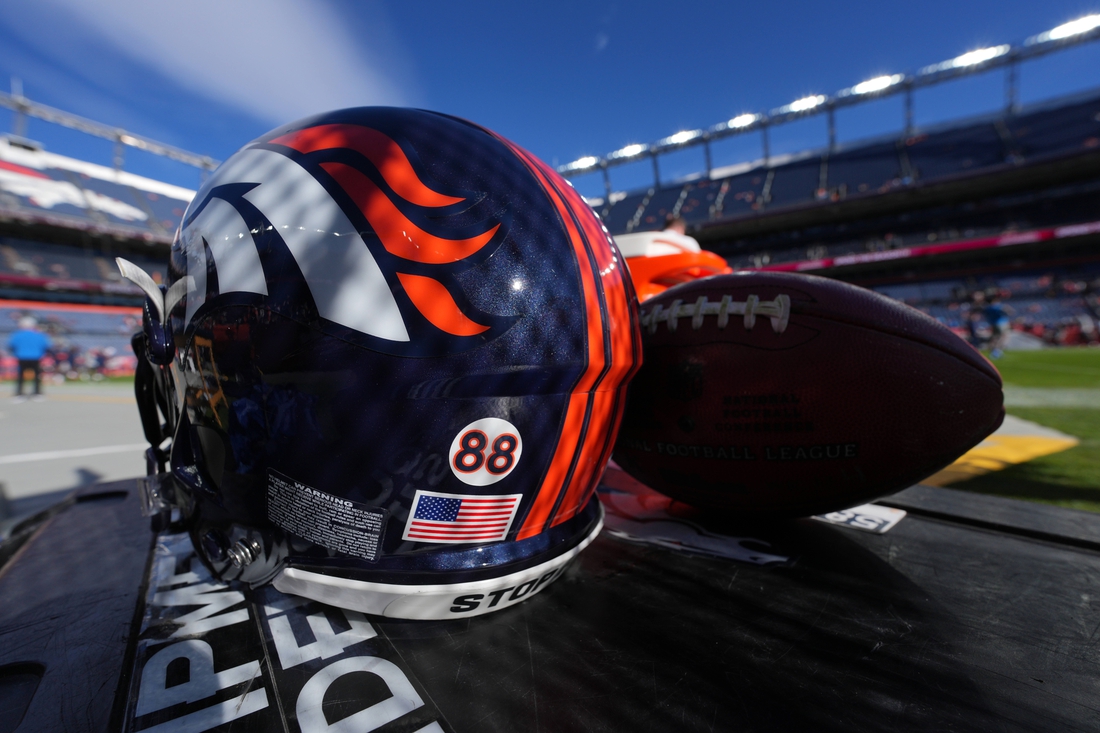 Dec 12, 2021; Denver, Colorado, USA; Detailed view of a memorial sticker on a Denver Broncos helmet in reference to American football player Demaryius Thomas before the game against the Detroit Lions at Empower Field at Mile High. Mandatory Credit: Ron Chenoy-USA TODAY Sports