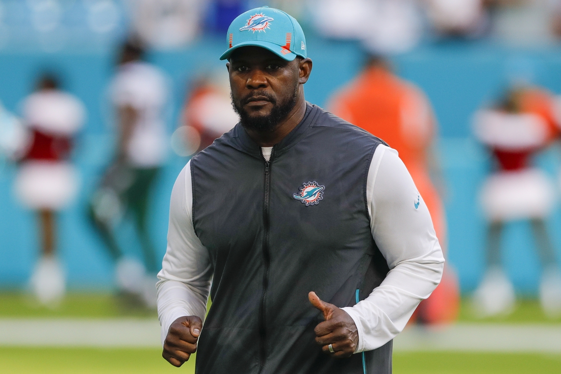 Dec 19, 2021; Miami Gardens, Florida, USA; Miami Dolphins head coach Brian Flores runs off the field after winning the game against the New York Jets at Hard Rock Stadium. Mandatory Credit: Sam Navarro-USA TODAY Sports