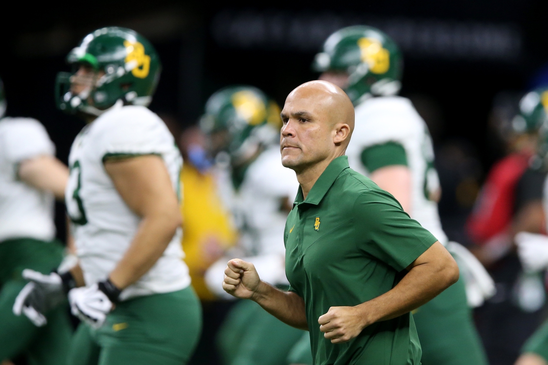 Jan 1, 2022; New Orleans, LA, USA; Baylor Bears head coach Dave Aranda runs onto the field before the 2022 Sugar Bowl against the Mississippi Rebels at the Caesars Superdome. Mandatory Credit: Chuck Cook-USA TODAY Sports