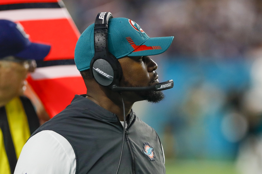 Jan 9, 2022; Miami Gardens, Florida, USA; Miami Dolphins head coach Brian Flores watches from the sideline during the second quarter against the New England Patriots at Hard Rock Stadium. Mandatory Credit: Sam Navarro-USA TODAY Sports