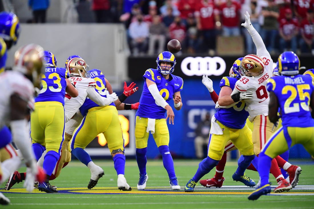 Jan 30, 2022; Inglewood, California, USA; Los Angeles Rams quarterback Matthew Stafford (9) throws a pass against the San Francisco 49ers in the first half during the NFC Championship Game at SoFi Stadium. Mandatory Credit: Gary A. Vasquez-USA TODAY Sports