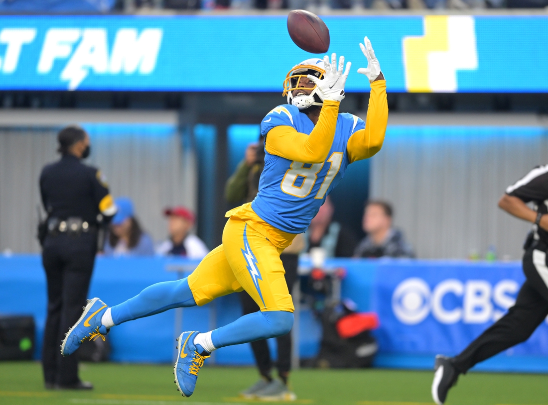 Jan 2, 2022; Inglewood, California, USA;  Los Angeles Chargers quarterback Justin Herbert (10) connects with Los Angeles Chargers wide receiver Mike Williams (81) for a 45 yard touchdown pass in the second half the game against the Denver Broncos at SoFi Stadium. Mandatory Credit: Jayne Kamin-Oncea-USA TODAY Sports
