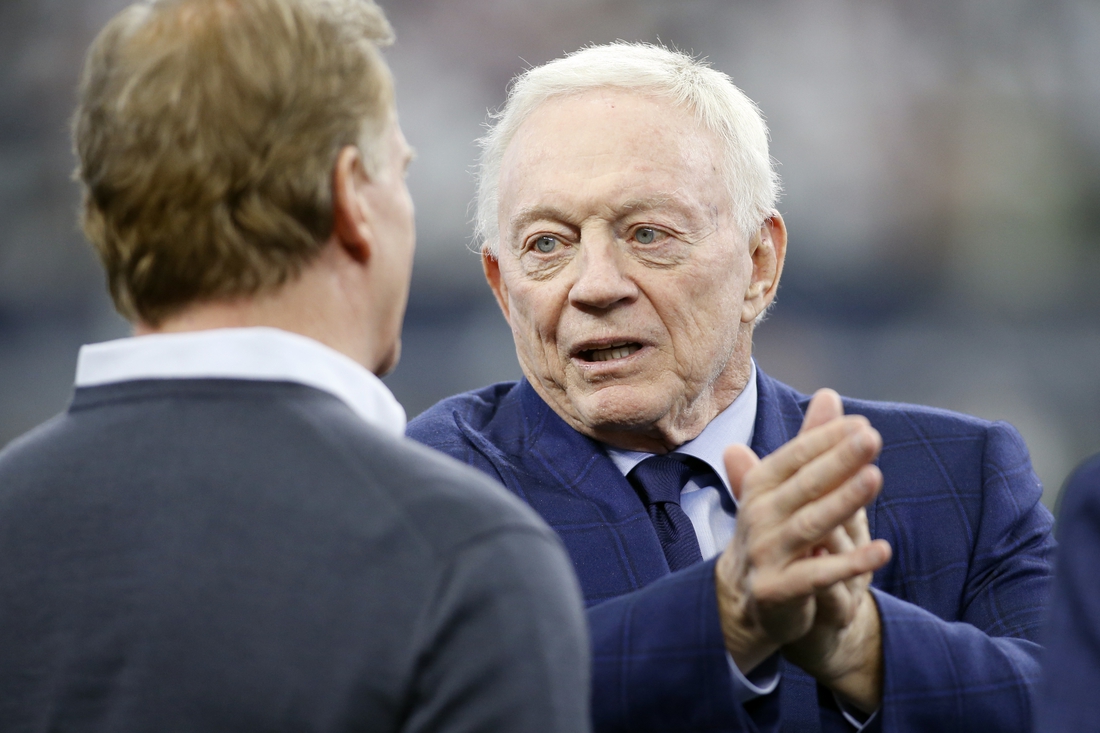 Jan 16, 2022; Arlington, Texas, USA; Dallas Cowboys owner Jerry Jones talks (R) with NFL Commissioner Roger Goodell (L) before the game against the San Francisco 49ers in a NFC Wild Card playoff football game at AT&T Stadium. Mandatory Credit: Tim Heitman-USA TODAY Sports