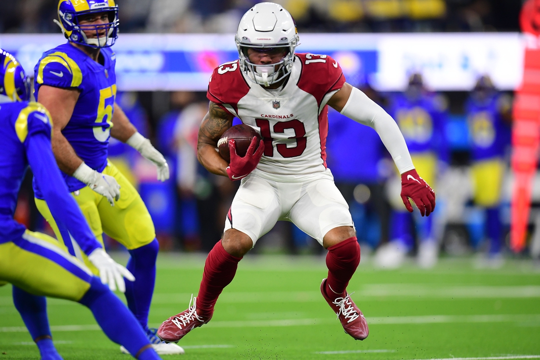 Jan 17, 2022; Inglewood, California, USA; Arizona Cardinals wide receiver Christian Kirk (13) runs the ball against the Los Angeles Rams during the second half in the NFC Wild Card playoff football game at SoFi Stadium. Mandatory Credit: Gary A. Vasquez-USA TODAY Sports