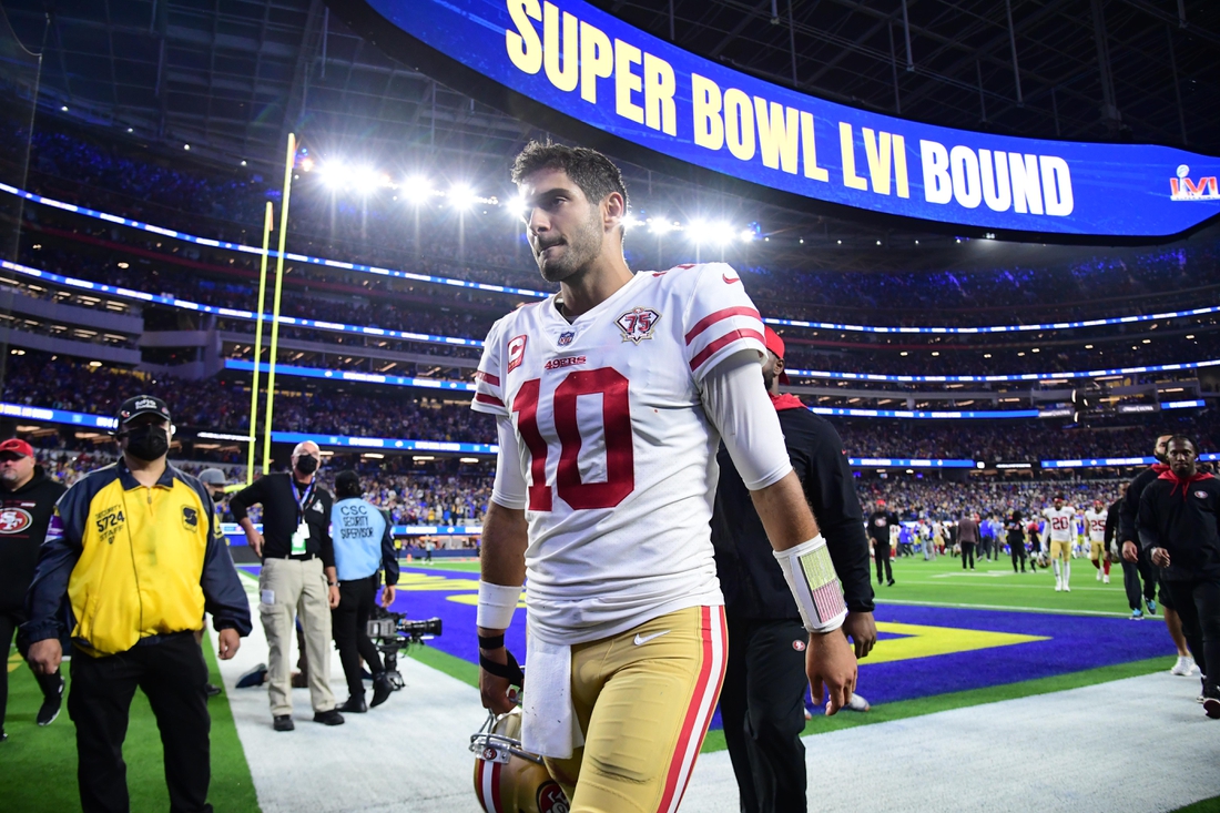 Jan 30, 2022; Inglewood, California, USA; San Francisco 49ers quarterback Jimmy Garoppolo leaves the field after losing to the Los Angeles Rams in the NFC Championship Game at SoFi Stadium. Mandatory Credit: Gary A. Vasquez-USA TODAY Sports